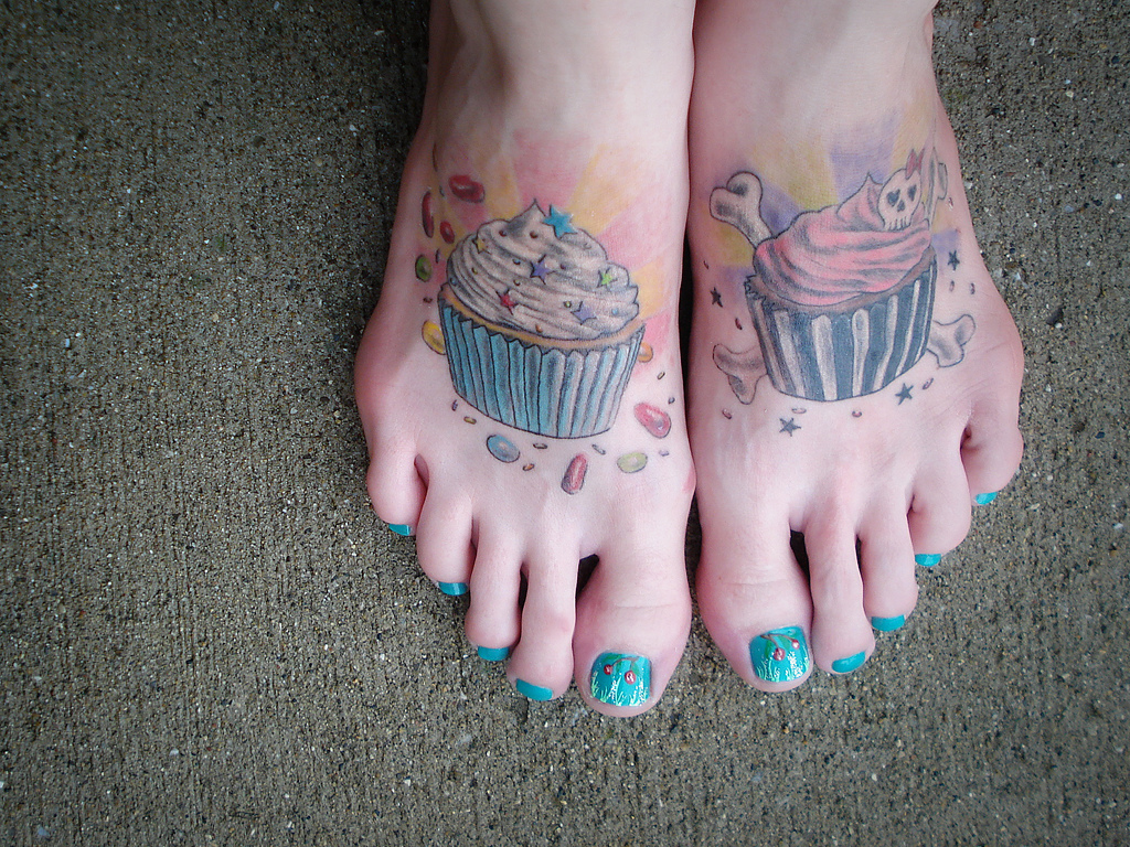 evil tattoos on the feet