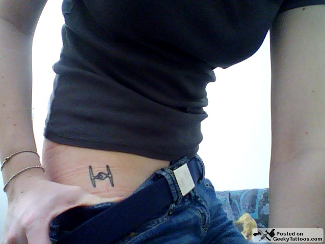 hip tattoo. hip spaceship tattoos.